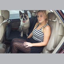 Load image into Gallery viewer, the woman is sitting with her  dog on the black car seat cover in the suv car