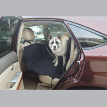 Load image into Gallery viewer, the dog is sitting on black  car seat protector for dogs in the suv 